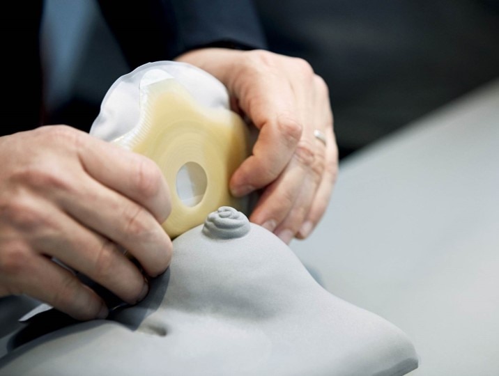 Picture of a person testing a stoma bag